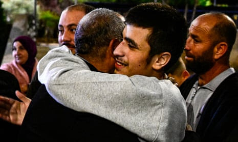 A Palestinian prisoner (R) greets a relative after being released.