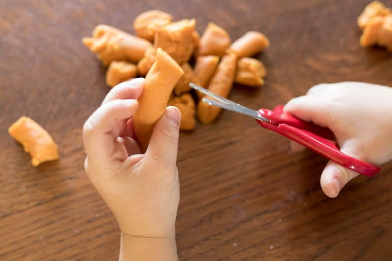 cutting play dough fine motor activity for preschoolers