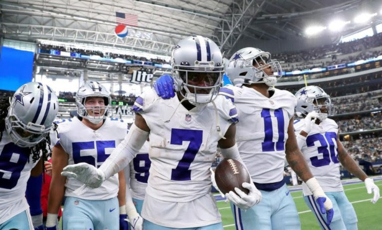 Trevon Diggs celebrates on the sidelines with Cowboys