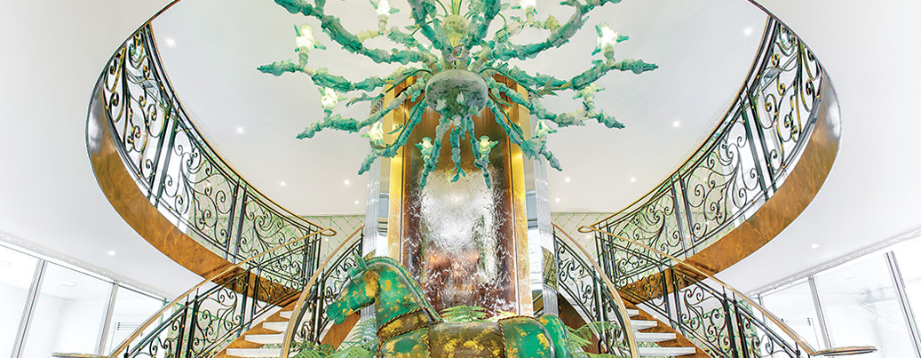 Uniworld Boutique River Cruise opulent lobby features a grand staircase