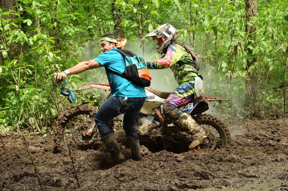 Saturday's overall ATV winner, Johnny Gallagher, lends a helping hand to Mckenzie Tricker.