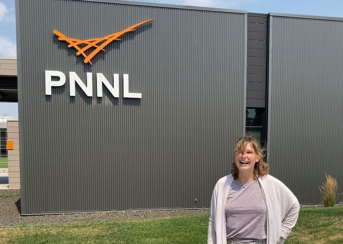 Portrait of Mallory Philliber in front of a PNNL building